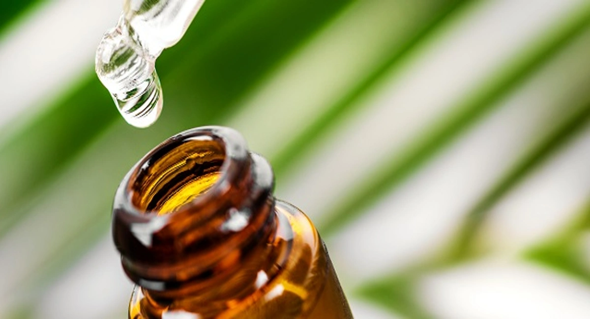 tea tree oli dropper and bottle close up
