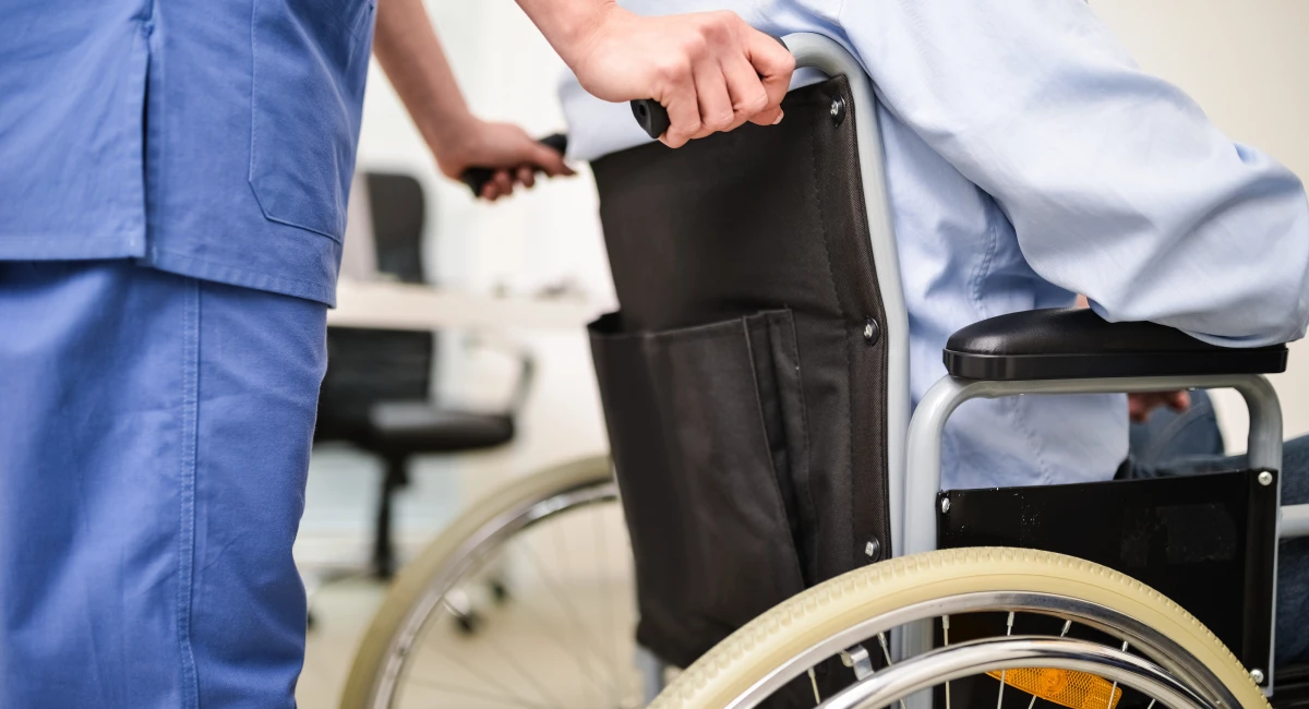 A patient being transferred in a wheelchair