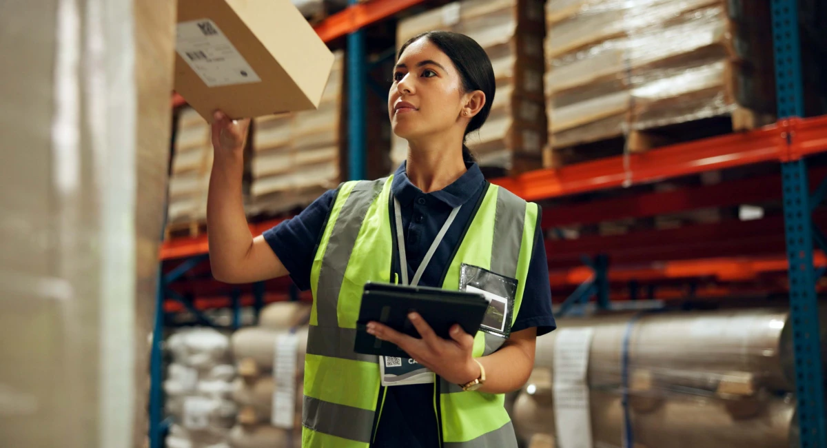 warehouse worker checking shipping packages