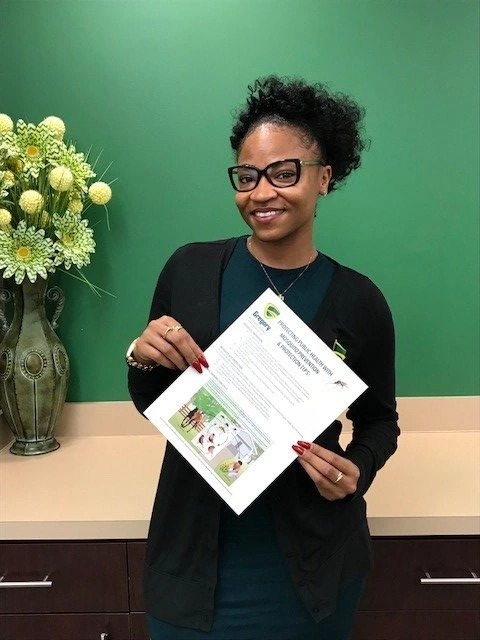 Gregory colleague holding physical prevention guide
