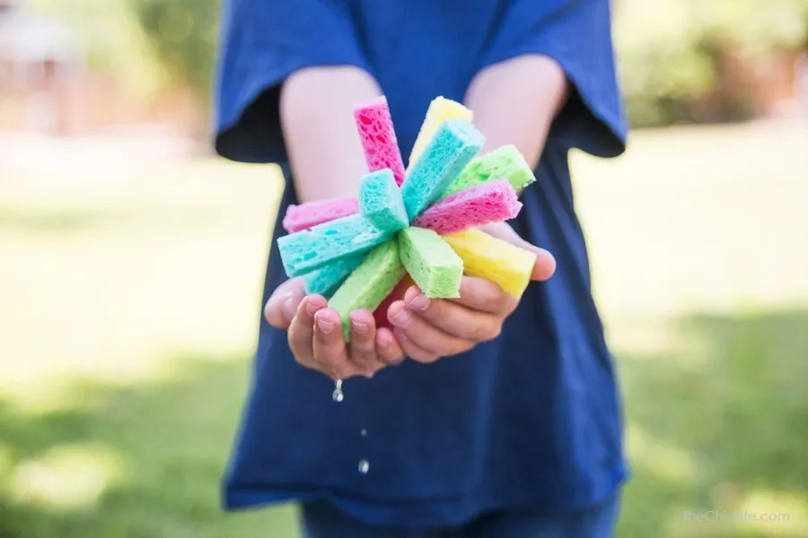 Child holding sponge water bomb
